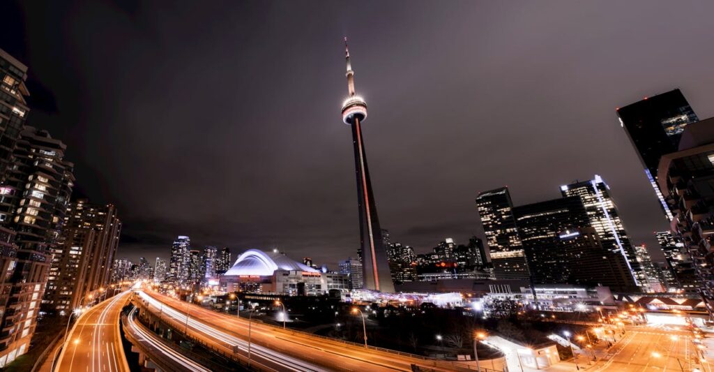 Cityscape with illuminated skyscrapers and tower